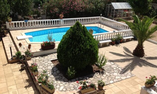 backyard garden swimming pool pool water house blue summer tropical