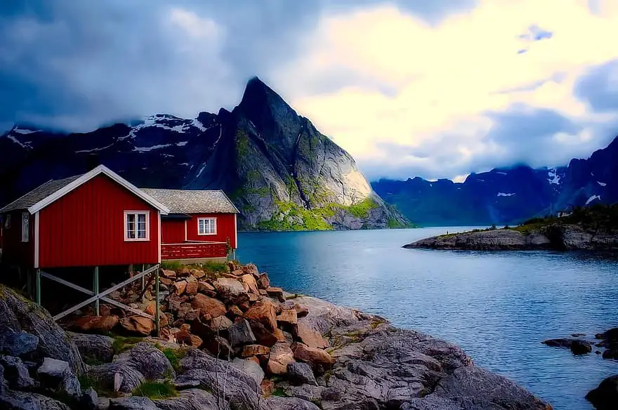 norway cottage house home mountains sky clouds sunset fjord