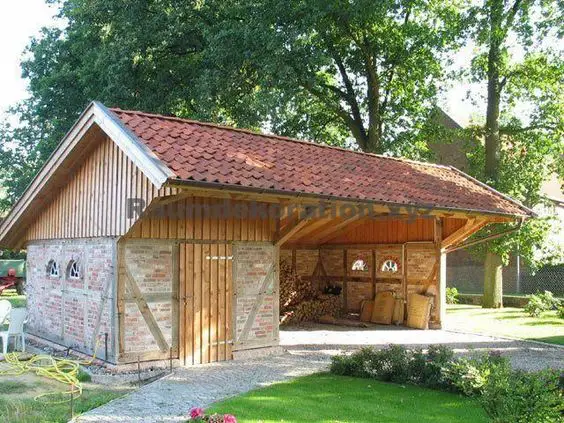 wooden garage with brick decor