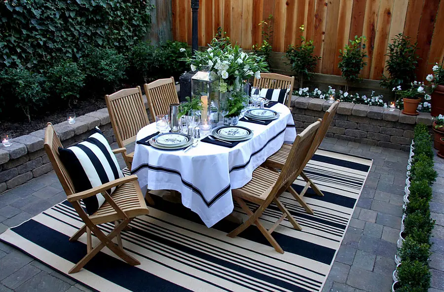 backyard dining area with rug