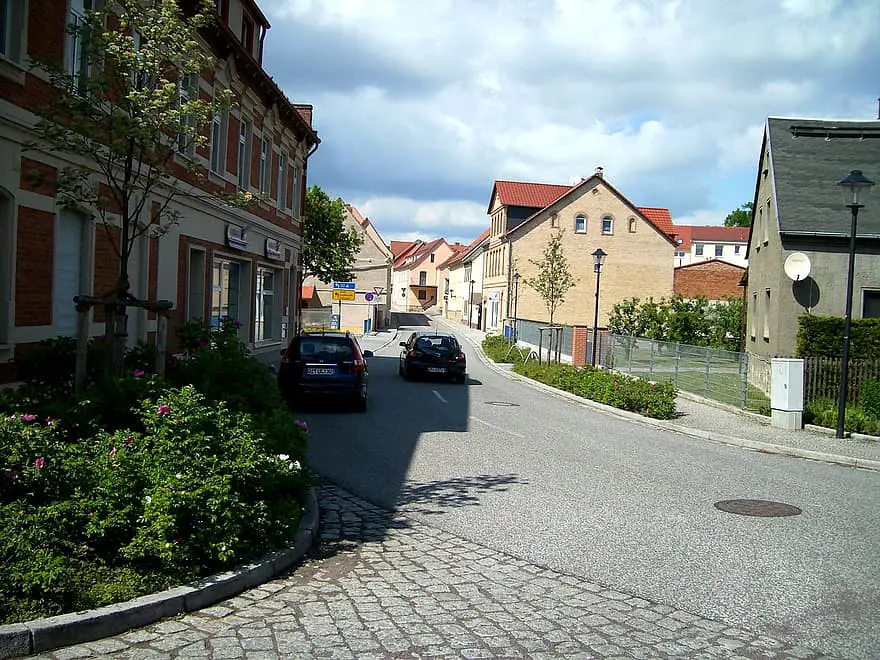 road asphalt road houses facades building vehicles small town bad lauchstadt