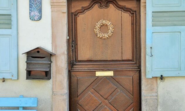 door wooden door carved door alsace house alsatian house windows village france