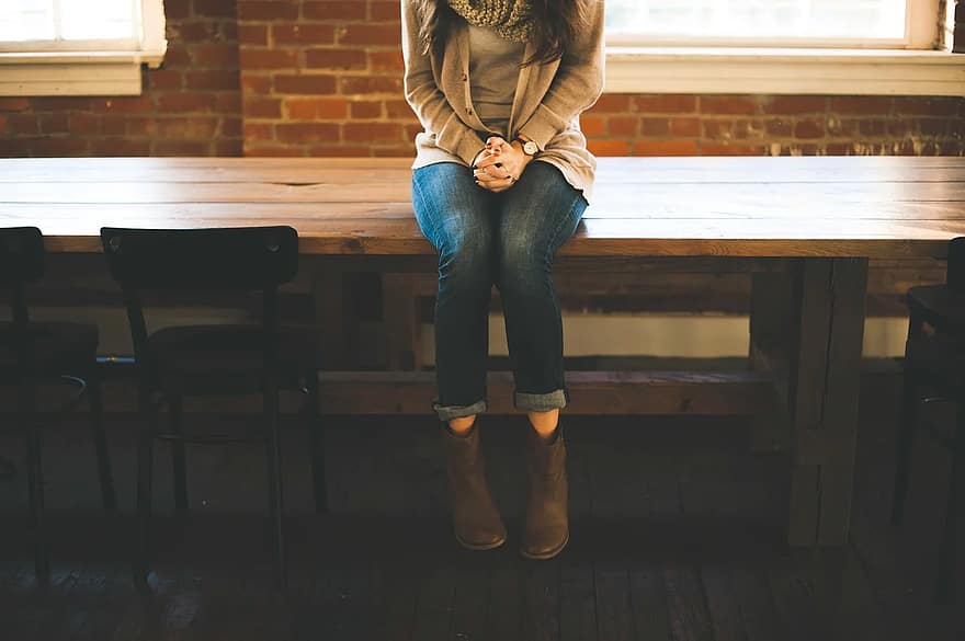 girl woman jeans boots fashion wood table chairs people