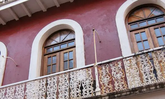 puerto rico building porches old building red architecture railing facade arches windows