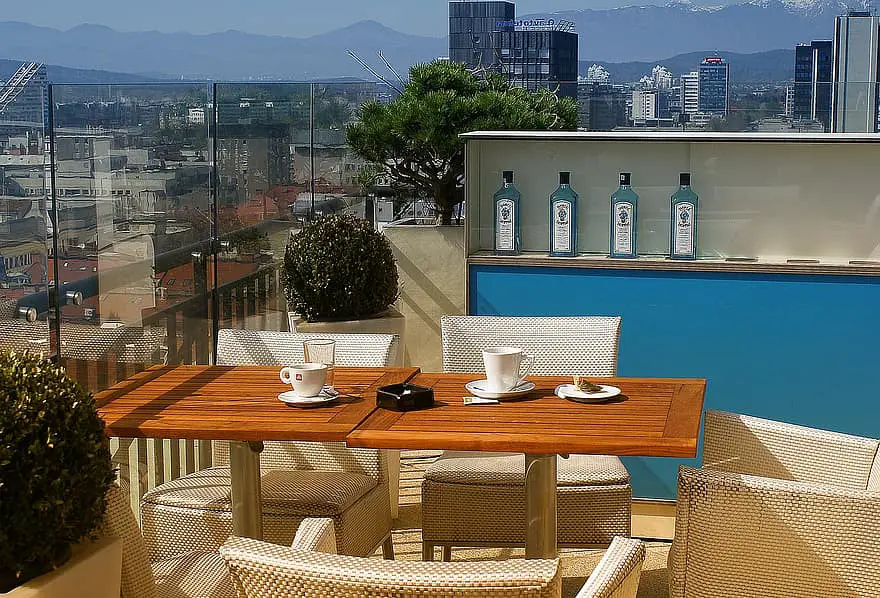 view view of the city terrace observation deck cafe panorama of the city table cup chairs