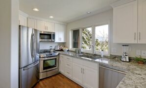 white cabinets with granite