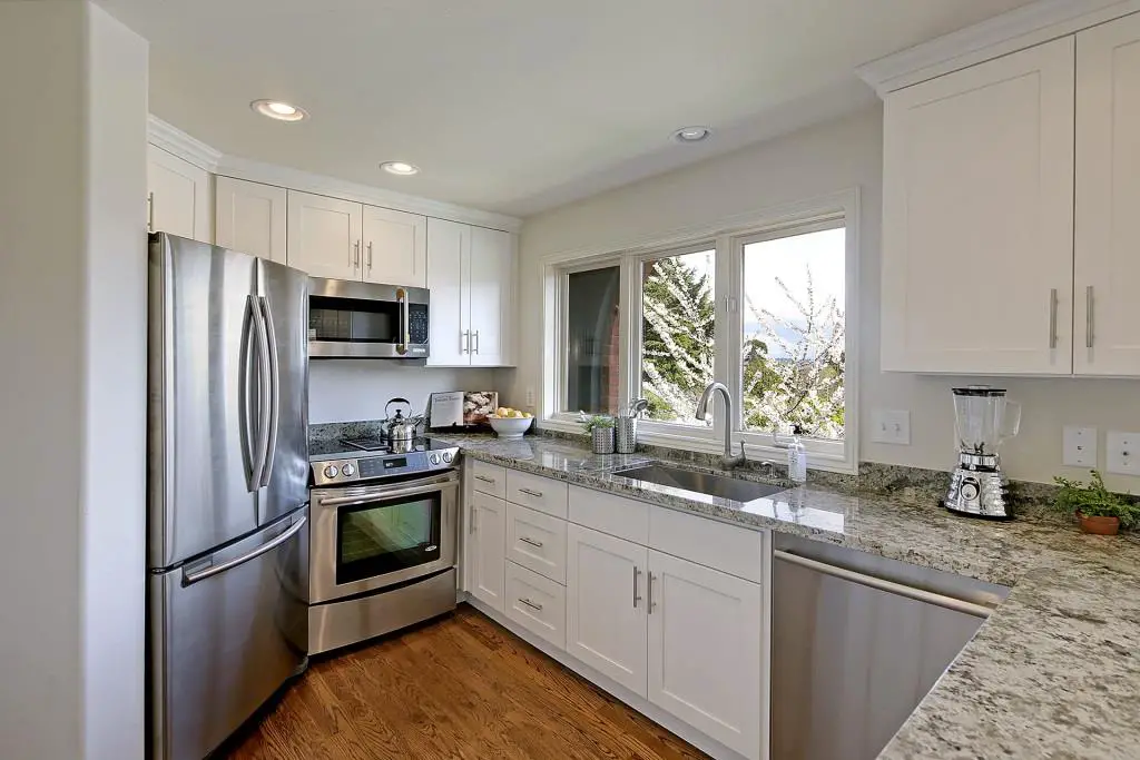 white cabinets with granite