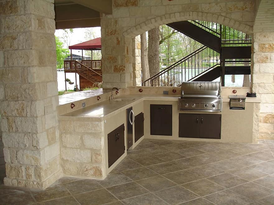 outdoor kitchen stone masonry copper cooking outdoor kitchen wood fireplace