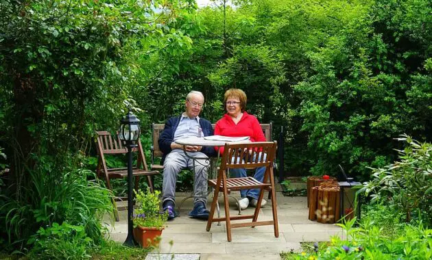 couple man woman sit rest garden terrace chair table