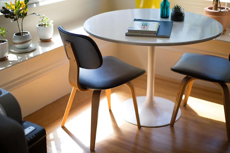 Round table with two wooden chairs