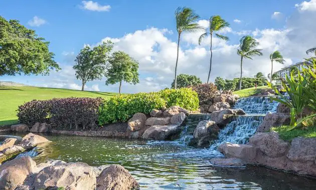 hawaii oahu waterfall rocks ko olina pond palm trees water landscape