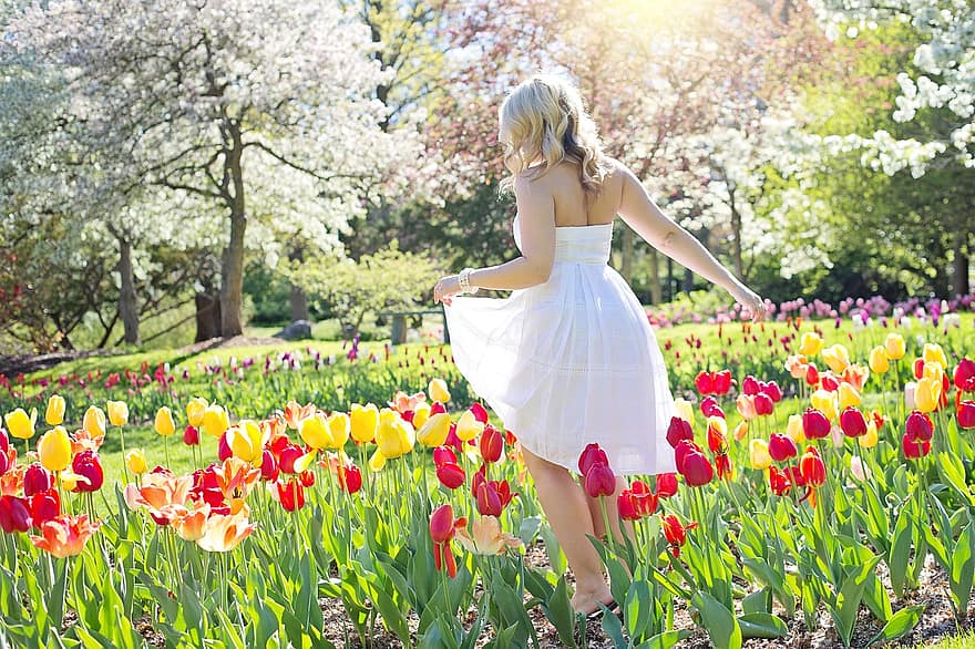 spring tulips pretty woman young woman flowers springtime female nature natural 1