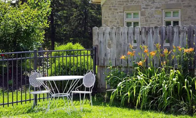 white outdoor patio furniture table two chairs set outside