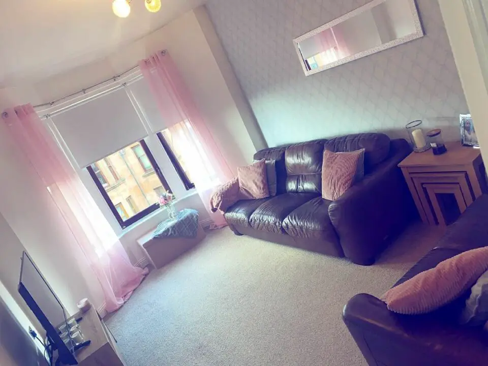 beautiful living room with pink curtain