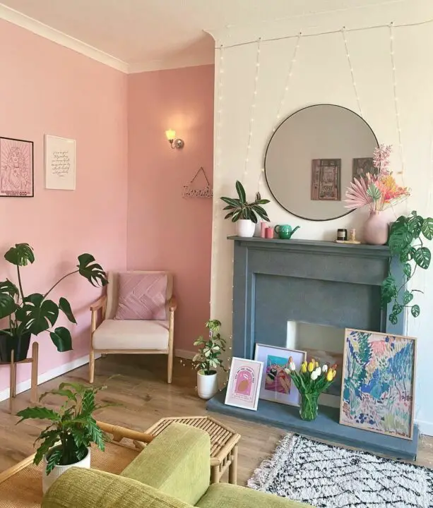 pink living room with wooden furniture