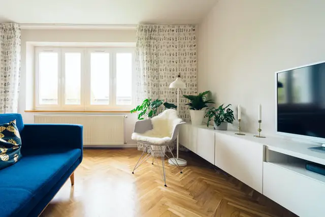 Blue sofa with white furniture