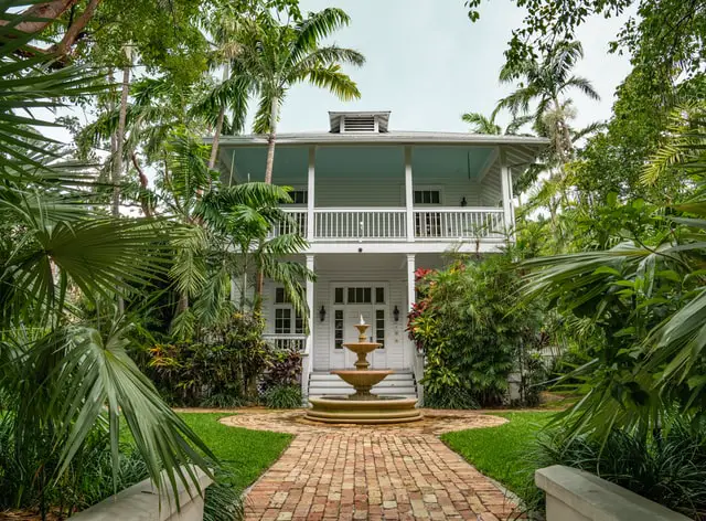 house with fountain and shades tree ideas Front Yard Landscaping