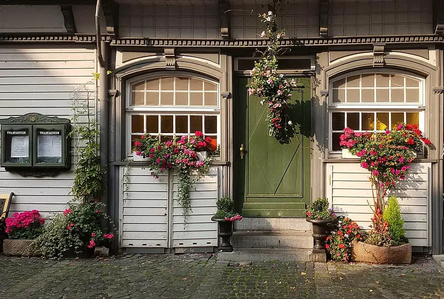 architecture restaurant house house facade window front door floral decorations flower boxes decorative