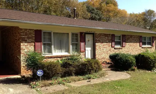 house brick front view shrubs front door home architecture residential estate